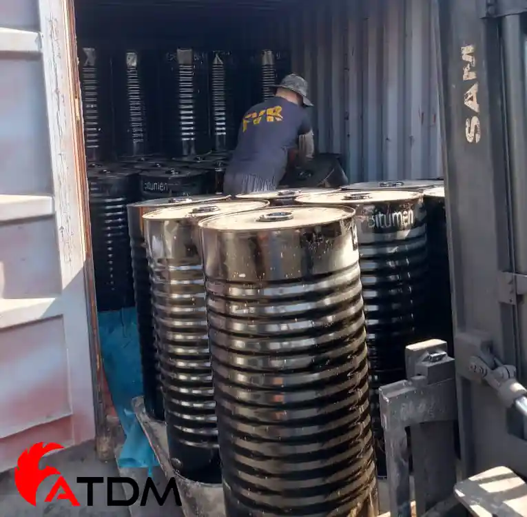 Bitumen 30/40 packed in new steel drums being loaded for export by ATDM manufacturer.