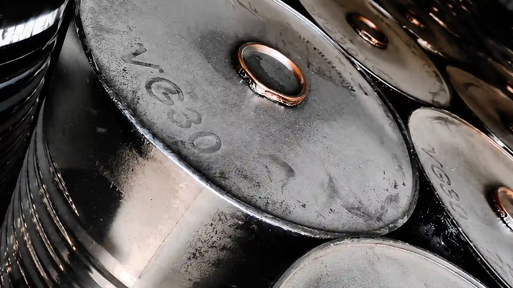 Bitumen VG30 and VG40 packed in steel drums for road construction and asphalt applications.